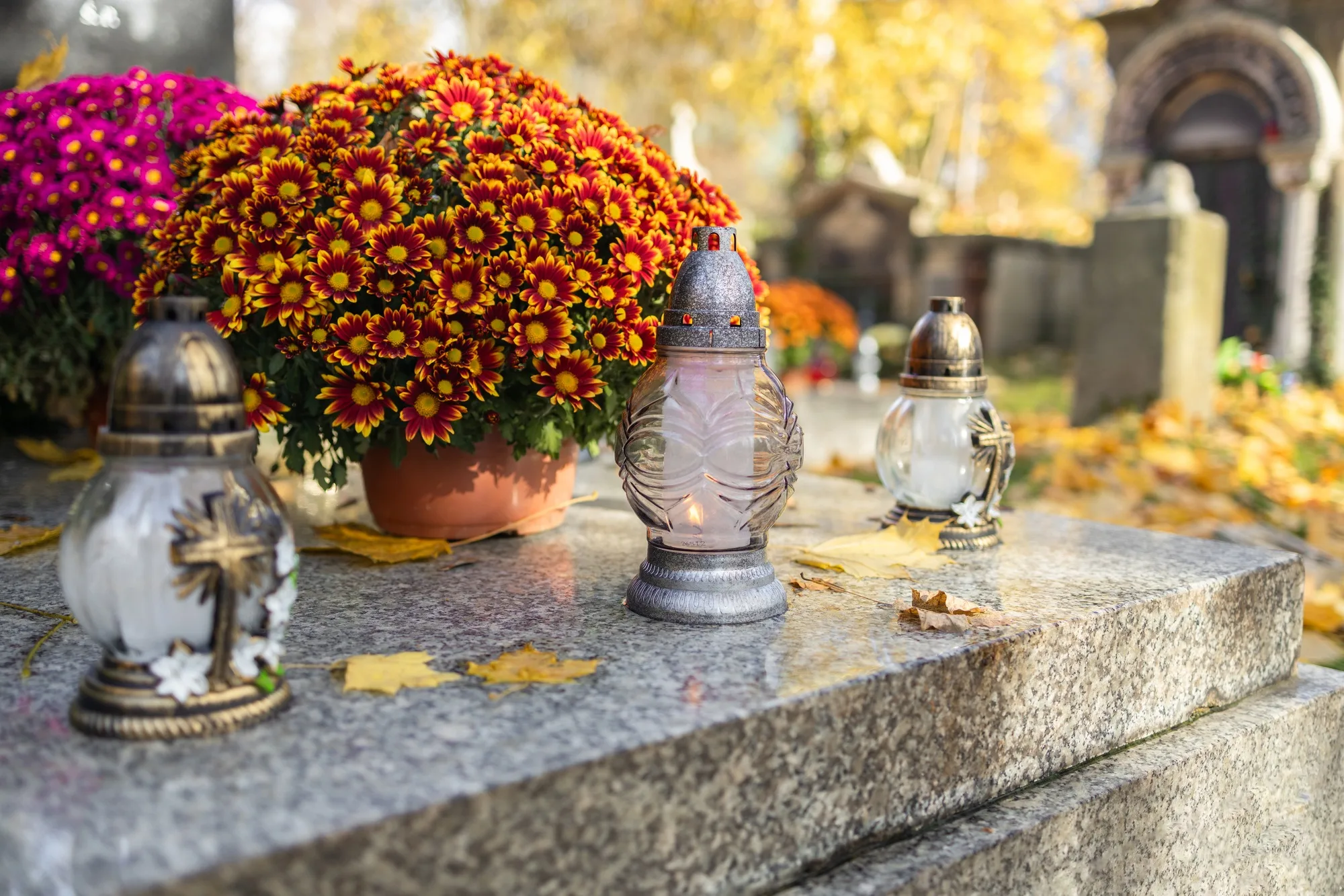 Decorated graves at a cemetery on All Saints Day (Wszystkich Swietych) in Poland.